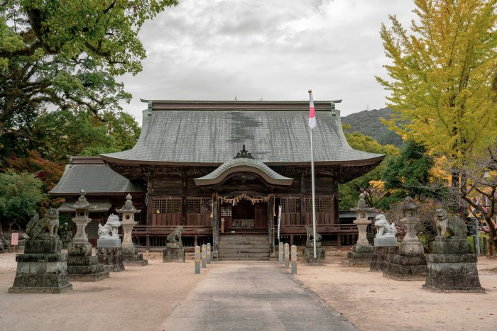 Traditional Japanese Shinto Shrine with Stone Statues