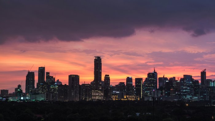 Manila Skyline Under a Sunset Sky