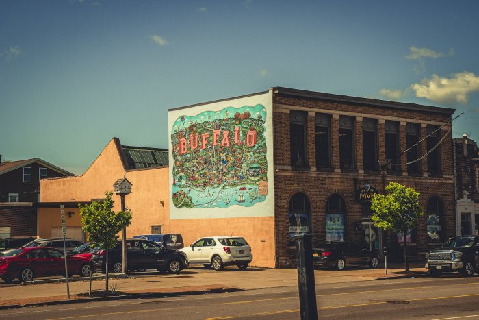 Buffalo Mural on Brick Building with Parked Cars