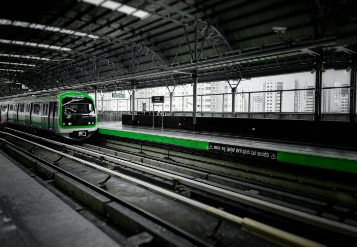 Green and White Metro Train at Station Platform