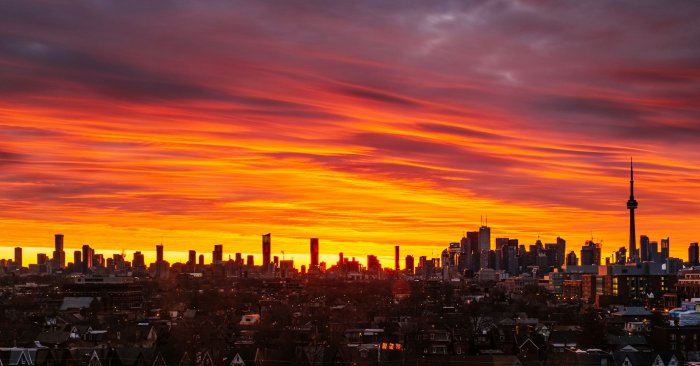 Toronto city skyline during a fiery orange sunset