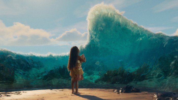 Young Moana facing a towering ocean wave