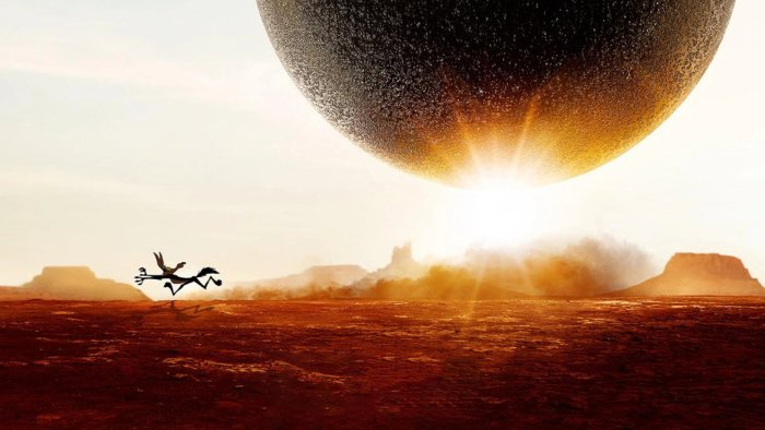 Wile E. Coyote running from giant sphere in Coyote vs. Acme
