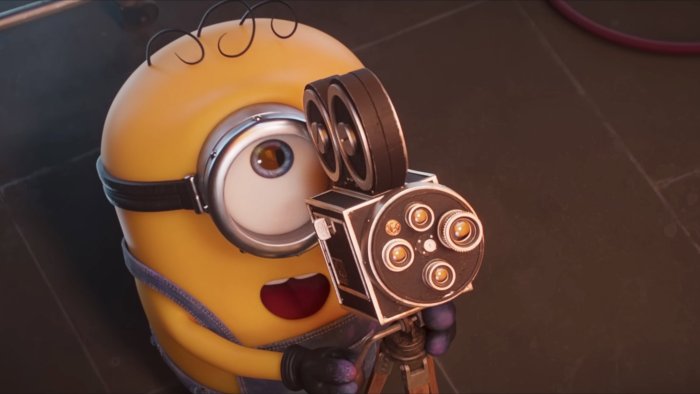 Stuart from Minions holding a vintage movie camera