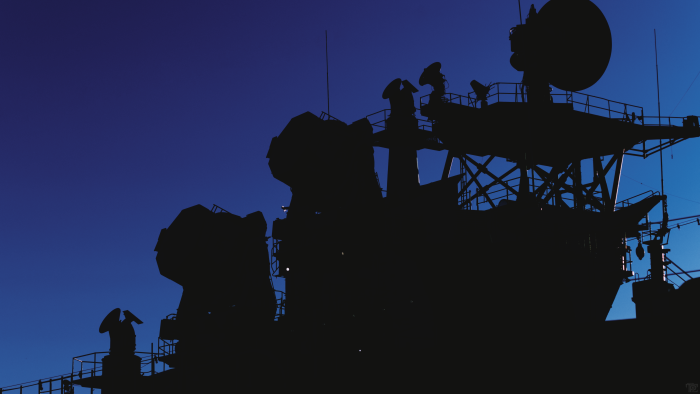 Silhouette of a Warship Superstructure Against Blue Sky