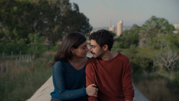 Man and woman in A Sad and Beautiful World