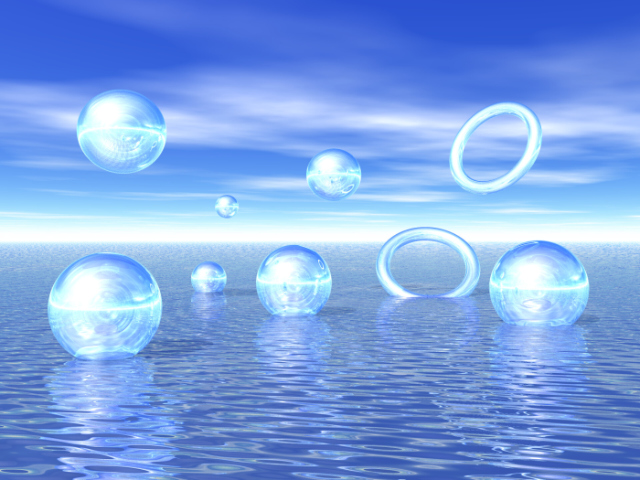 Blue glass spheres and rings on water surface