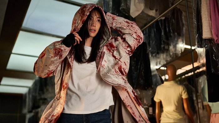 Han So-hee wearing a blood-stained jacket in Colony