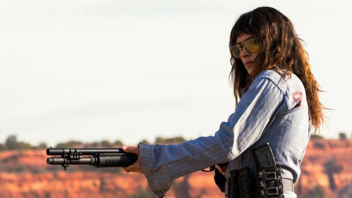 Adria Arjona holding a shotgun in Onslaught