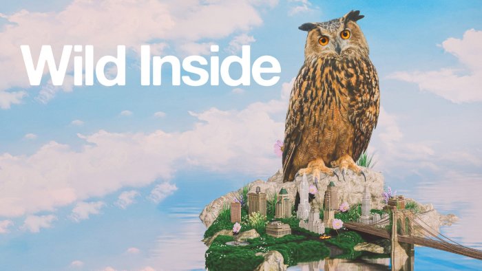 Giant owl perched on miniature city in Wild Inside