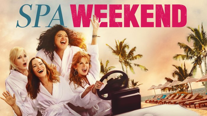 Women in spa robes driving a golf cart in Spa Weekend