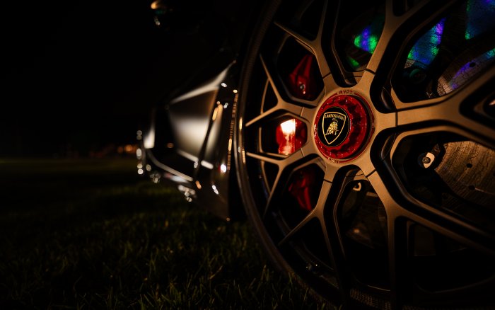 Close-up of a Lamborghini Wheel at Night