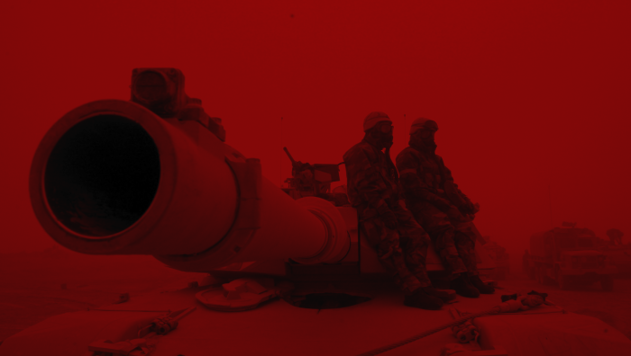 Military tank and soldiers in a red dust storm