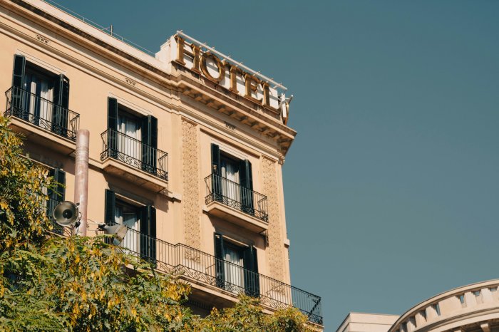 Classic Hotel Building Facade with Gold Sign