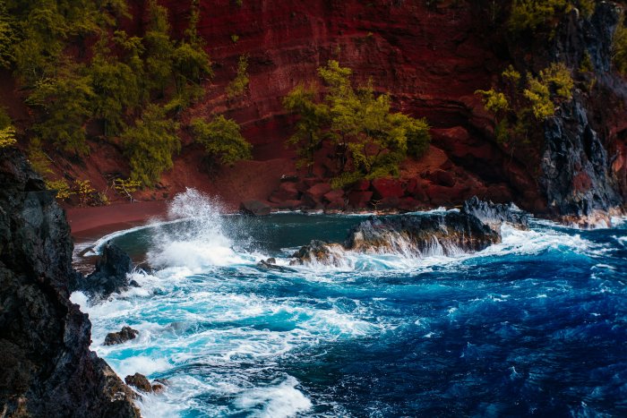 Red Sand Beach with Crashing Ocean Waves