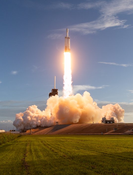 SpaceX Falcon Heavy Rocket Launching Into Blue Sky