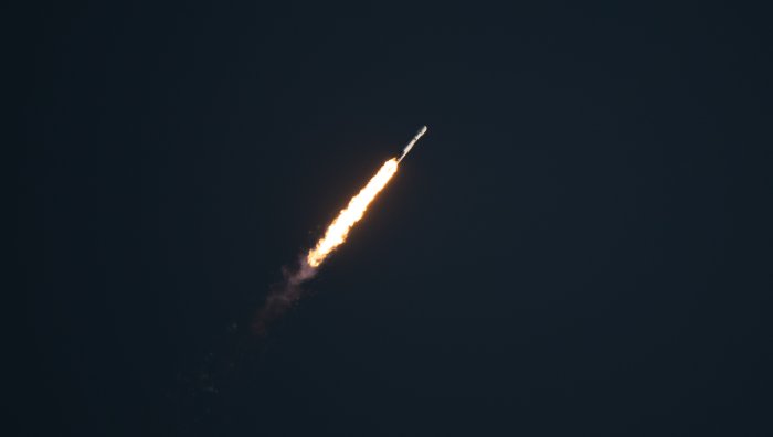 Falcon Heavy Rocket Launching into the Dark Sky