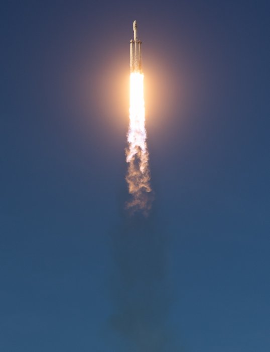SpaceX Falcon Heavy Rocket Launching Into Blue Sky