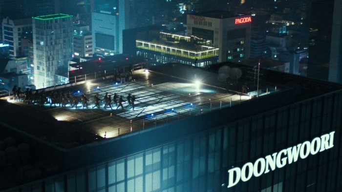 Armed Soldiers on a City Rooftop in Colony