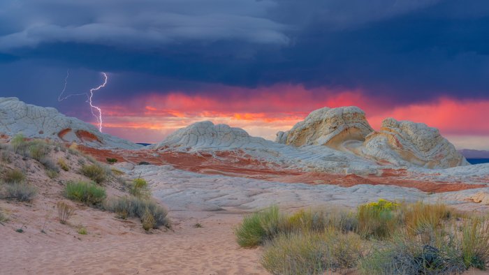 Lightning storm over White Pocket Arizona at sunset