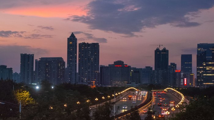 City Skyline and Highway Traffic at Dusk