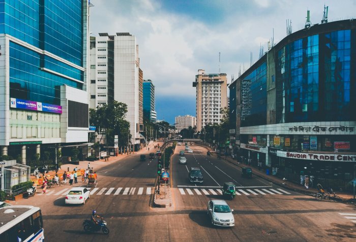 City street with traffic and tall modern buildings