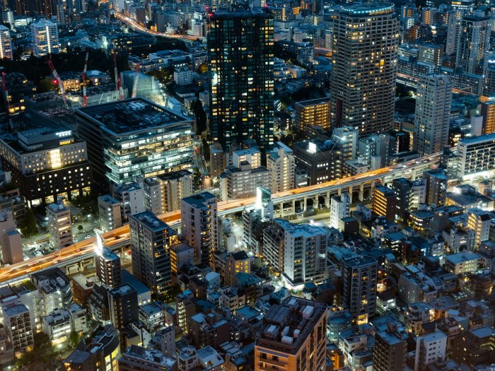 Aerial View of a Dense City Skyline at Night
