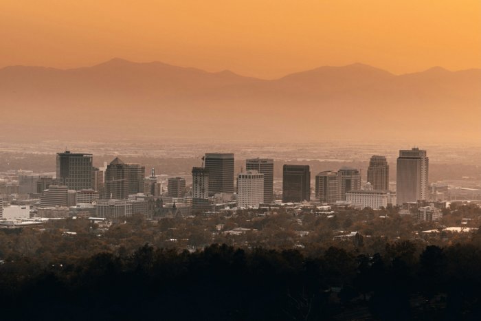 Salt Lake City skyline under orange sunset sky