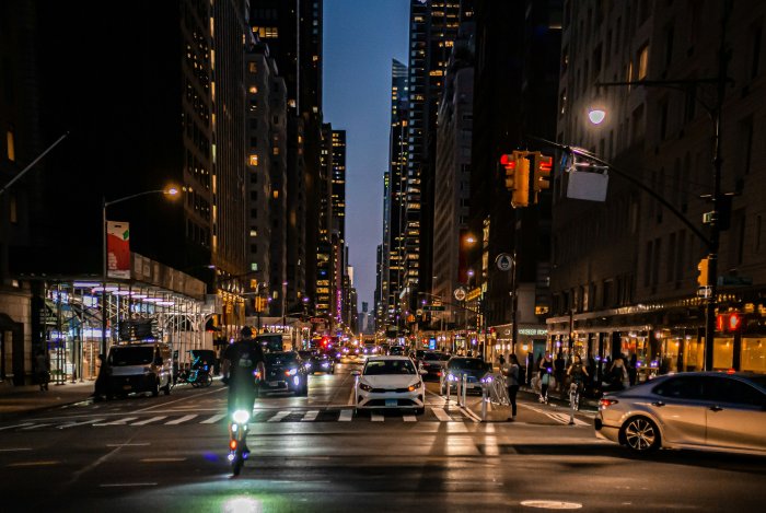 Busy New York City Street at Night with Traffic
