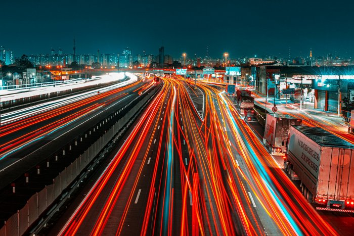 Long exposure traffic light trails on highway at night