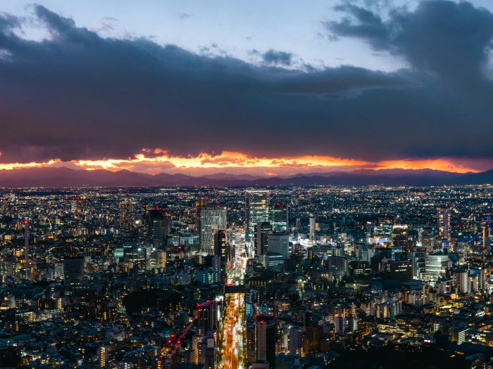 City Skyline at Night Under Dramatic Sunset Sky