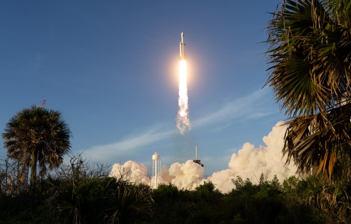 SpaceX Falcon Heavy Rocket Launching into Blue Sky