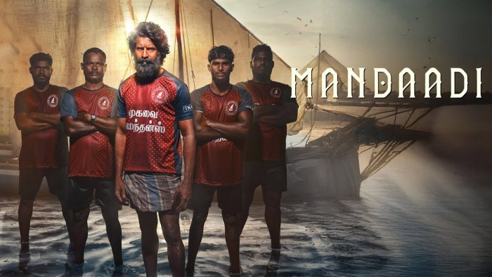 Five men standing in water in Mandaadi