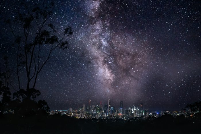 Milky Way Galaxy Over City Skyline at Night