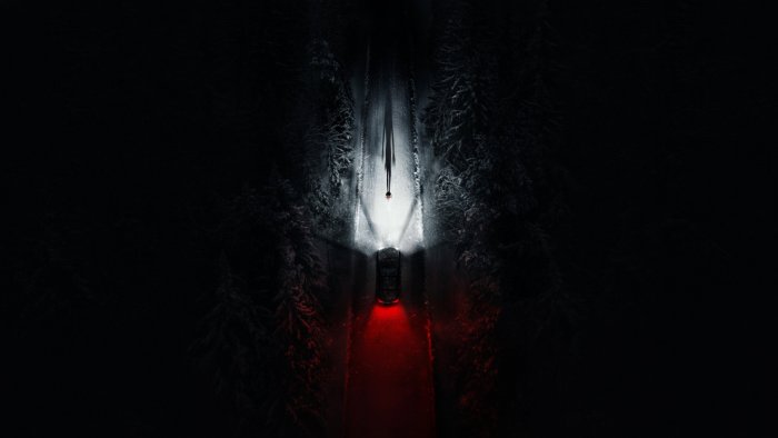 Car illuminating a figure on a snowy road, Resident Evil