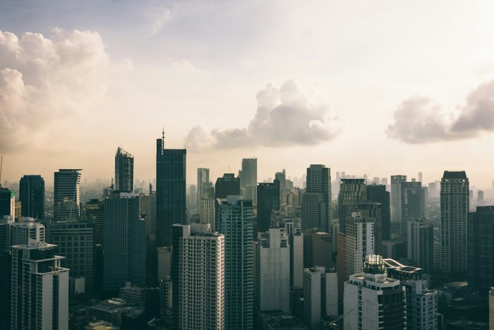Aerial view of a dense city skyline with skyscrapers