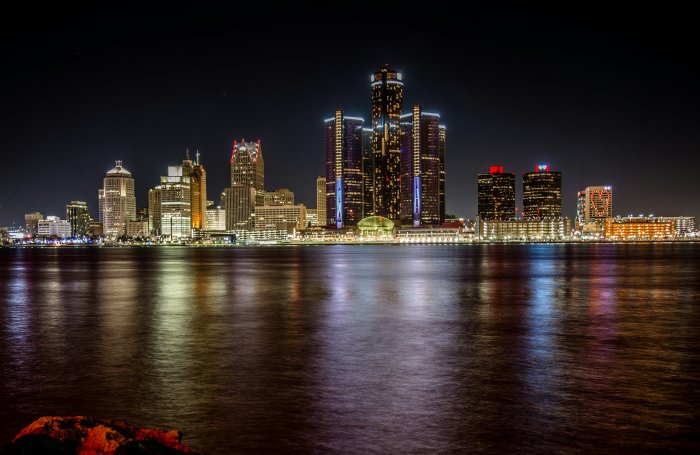 Detroit skyline at night with river reflections
