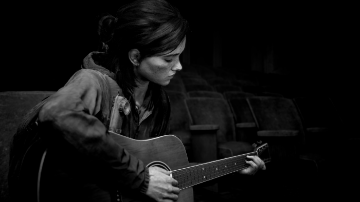 Ellie playing guitar in The Last of Us Part II