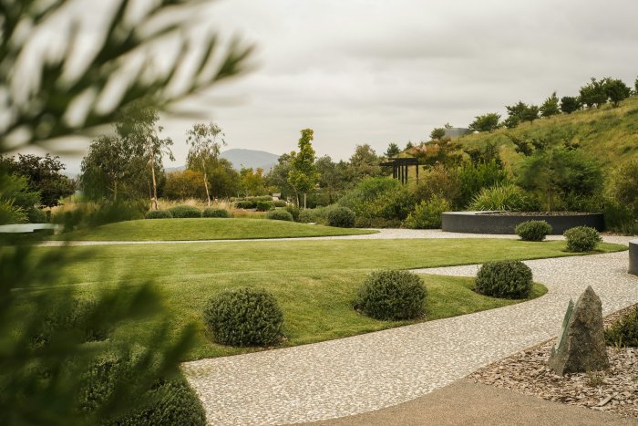 Landscaped Garden with Green Lawn and Winding Path