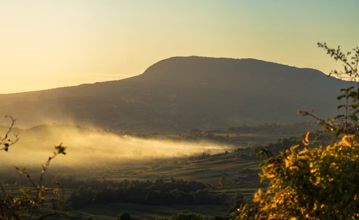 Misty Valley and Mountain at Golden Hour