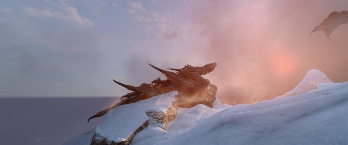 Dragon on a snowy mountain peak at sunrise
