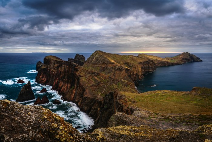 Rugged coastline with dramatic clouds over the ocean