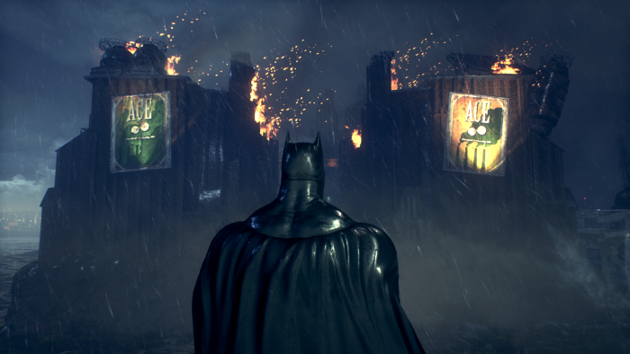 Batman in front of burning Ace Chemicals building