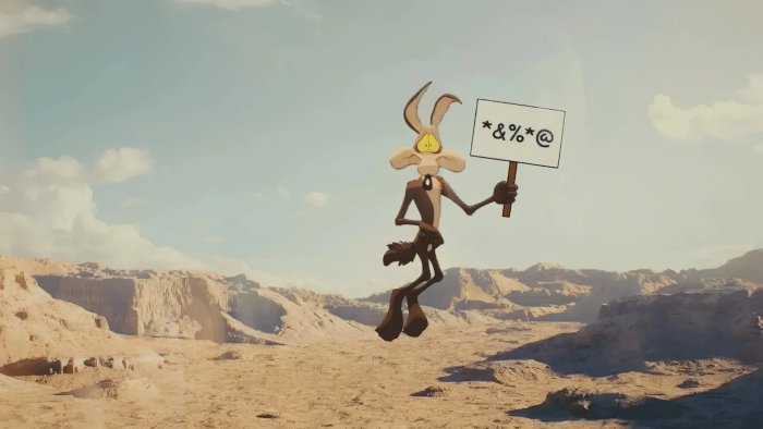 Wile E. Coyote holding a sign in a desert