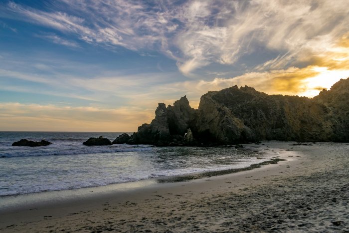 Rocky coastline with waves and dramatic sky