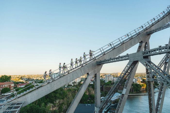 People climbing the Story Bridge in Brisbane