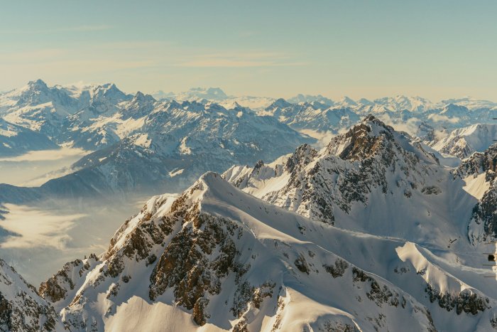 Snow-covered mountain range under a clear sky