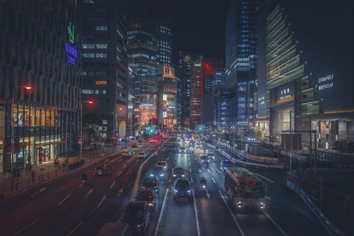 Busy City Street at Night with Traffic and Buildings