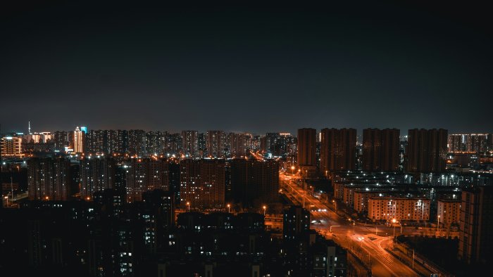 Cityscape at night with illuminated buildings