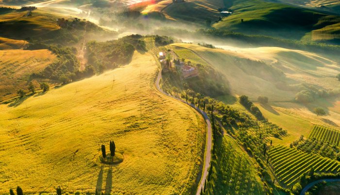Aerial view of Tuscan landscape with rolling hills and cypress trees